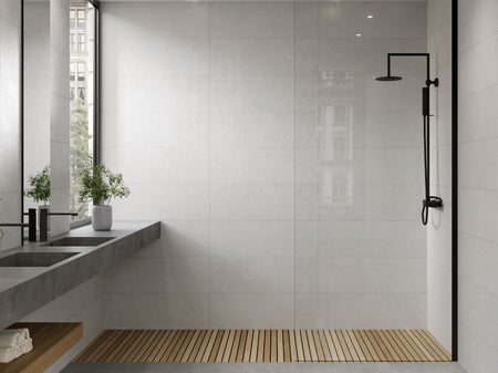 Modern bathroom with a white tiled walls, a shower, and a window.