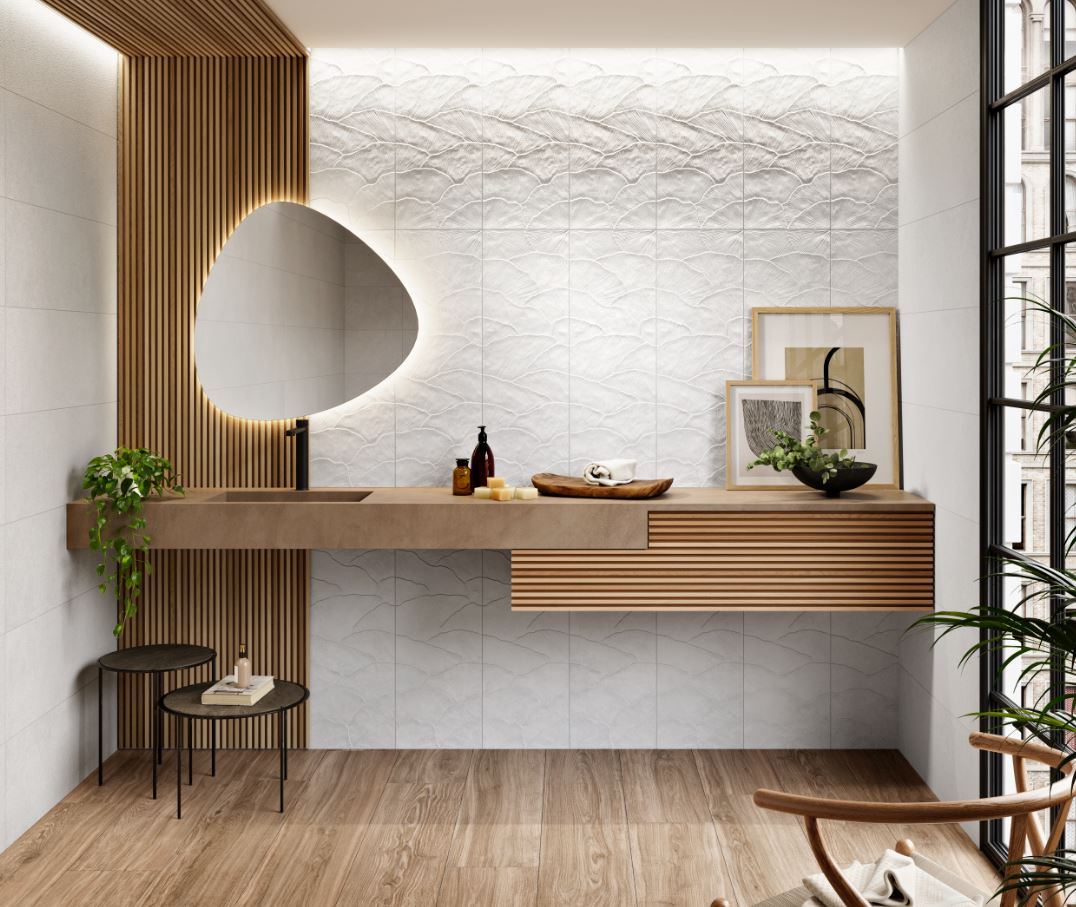 Modern bathroom with wooden vanity, decorative white tiled wall, and decorative elements.