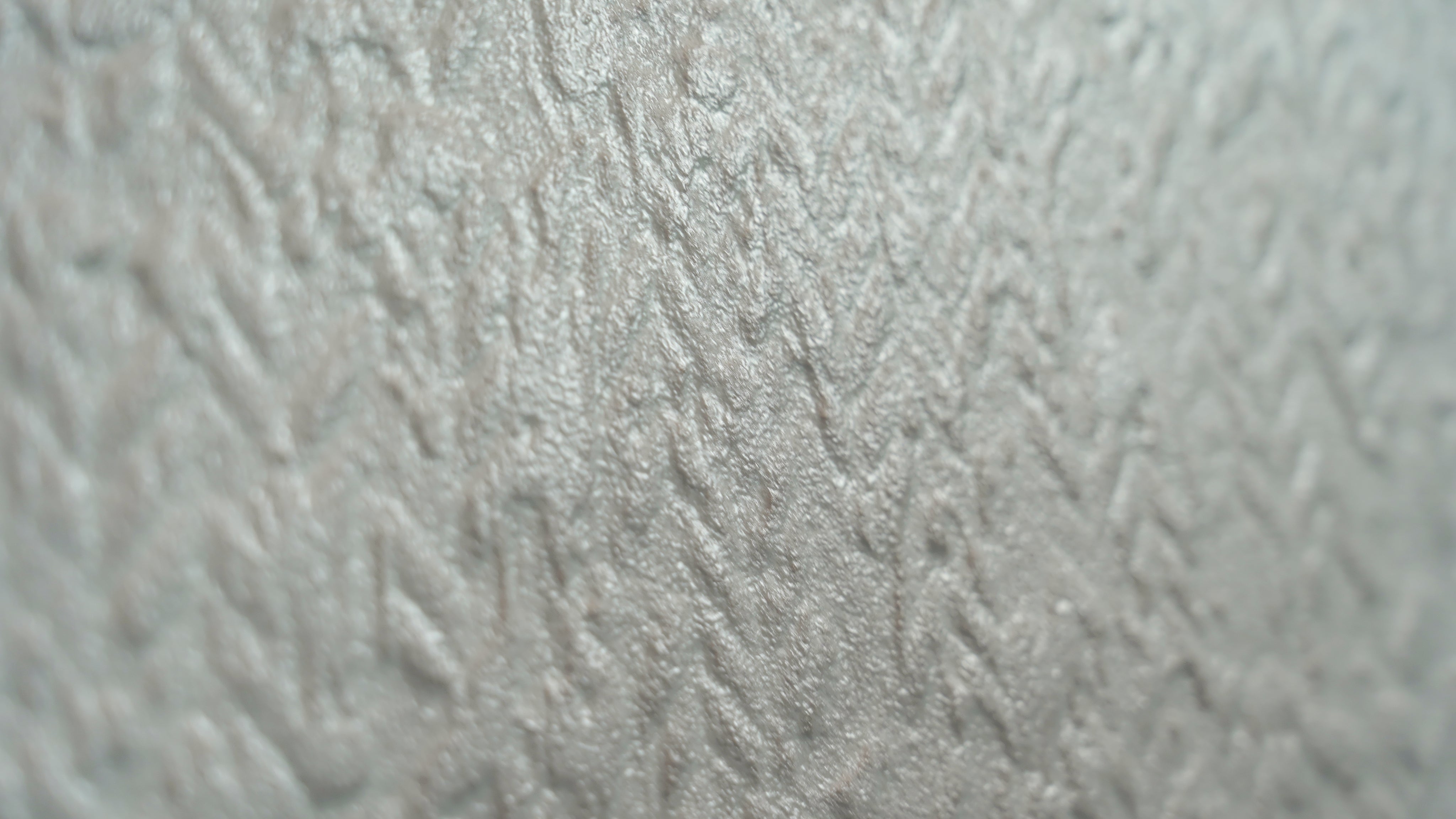 Close-up of a textured white Seashell Concept tile surface