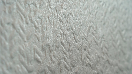 Close-up of a textured white Seashell Concept tile surface